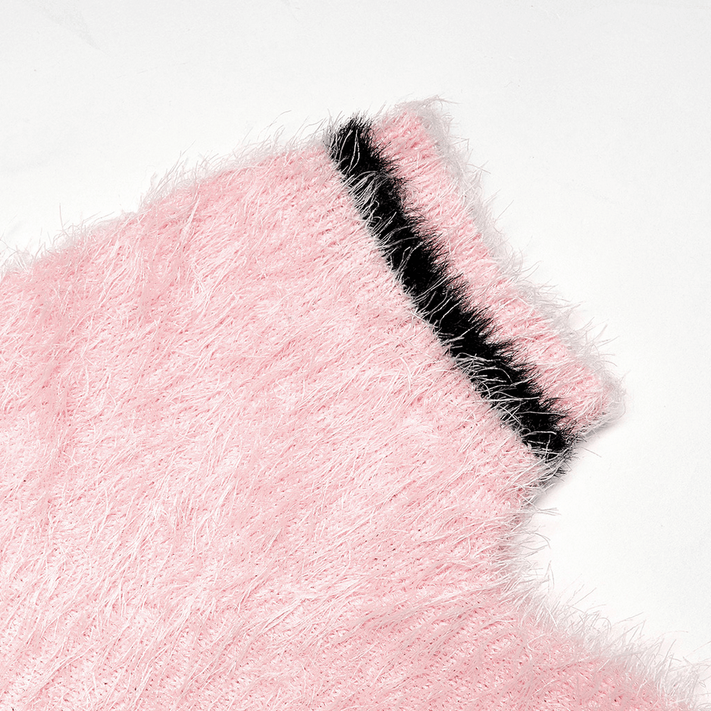 Close-up of pink faux fur fabric featuring black trim, part of the Punk Rave Cherry Skull Crop Sweater.