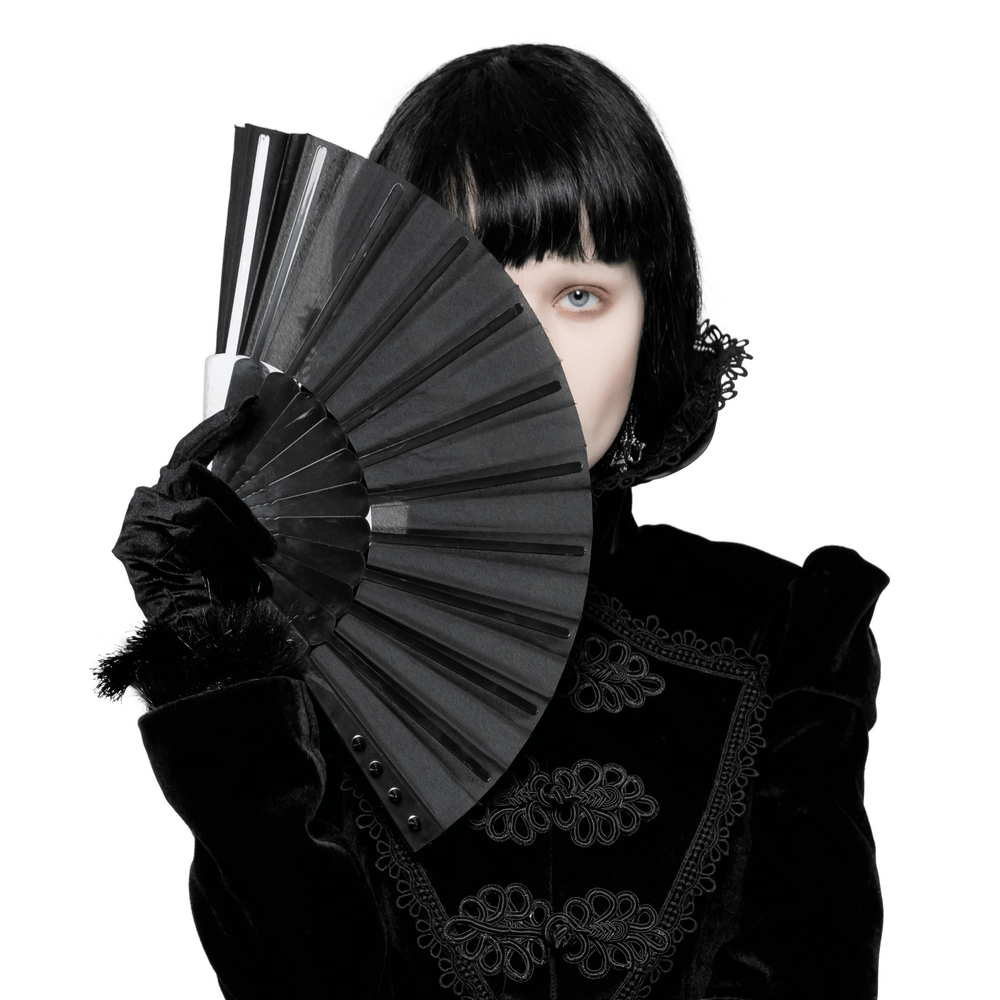 Gothic woman holding a Punk Rave spiked folding fan, showcasing dark elegance and edgy charm.