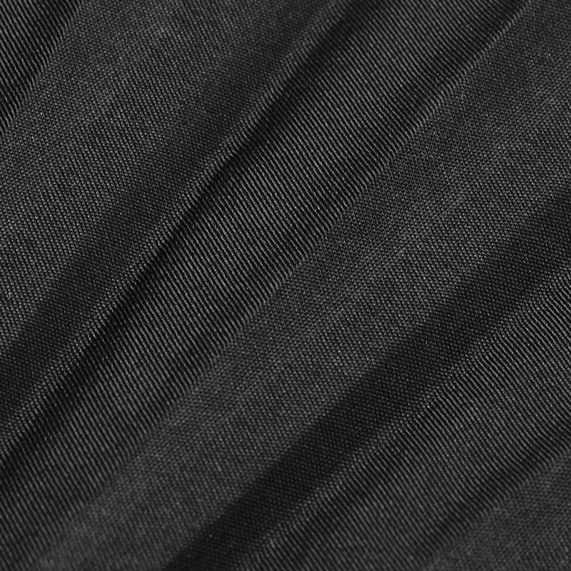 Close-up of textured black fabric, featured in the Punk Rave Spiked Folding Fan for a gothic elegance.