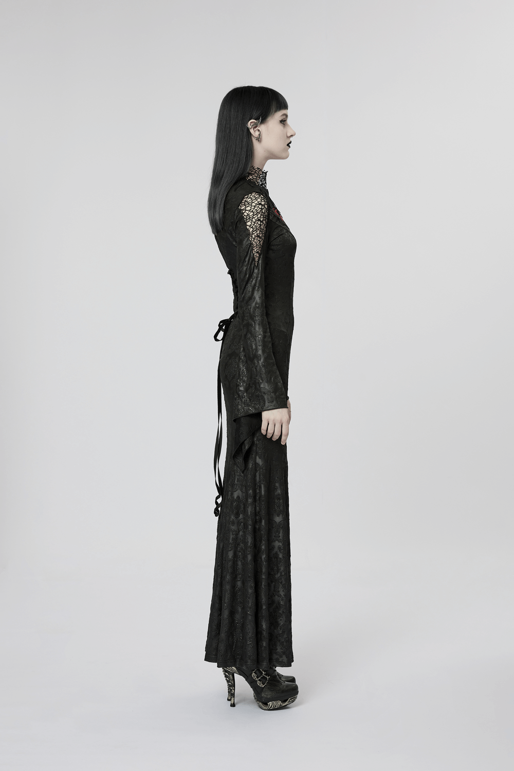 Side view of a model in a Punk Rave Vintage Dark Night Embossed Mesh Gown with lace details and elegant silhouette.