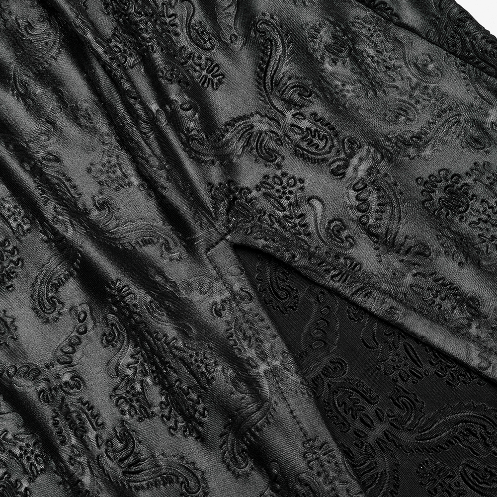 Close-up of embossed black fabric with intricate rose patterns, showcasing Gothic elegance for a witch dress.