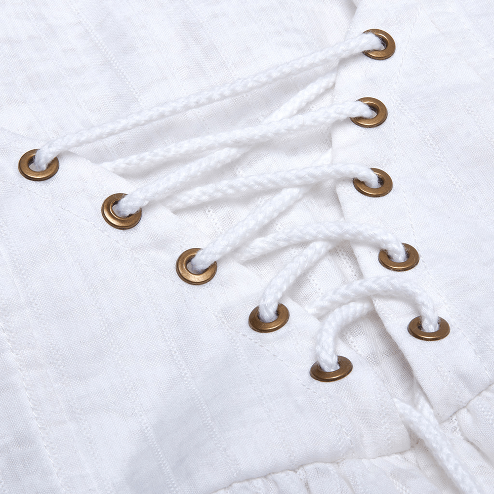 Close-up of white vintage lace dress with grommets and lace-up detailing for a steampunk style.