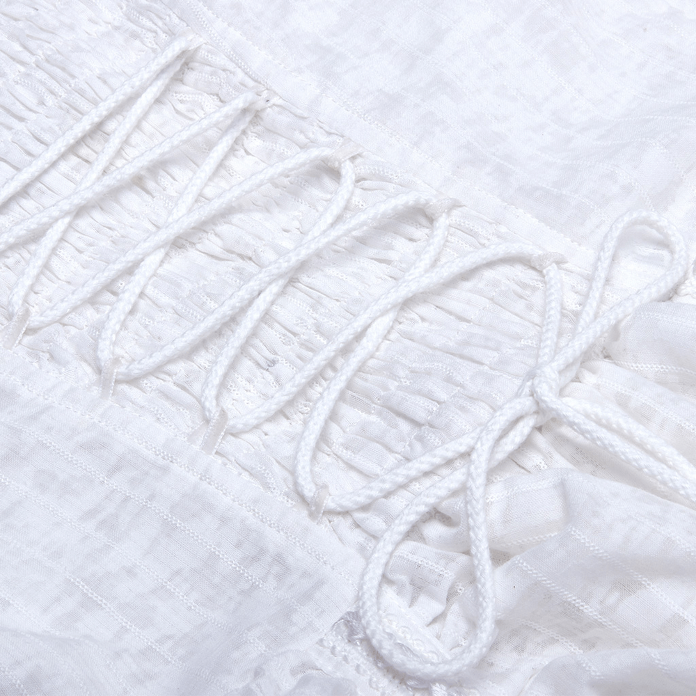 Close-up of lace detail with delicate white lacing on a gothic dress, showcasing intricate craftsmanship.