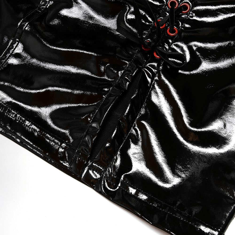 Close-up of shiny black PU leather mini skirt with red drawstring accents and front slit details.