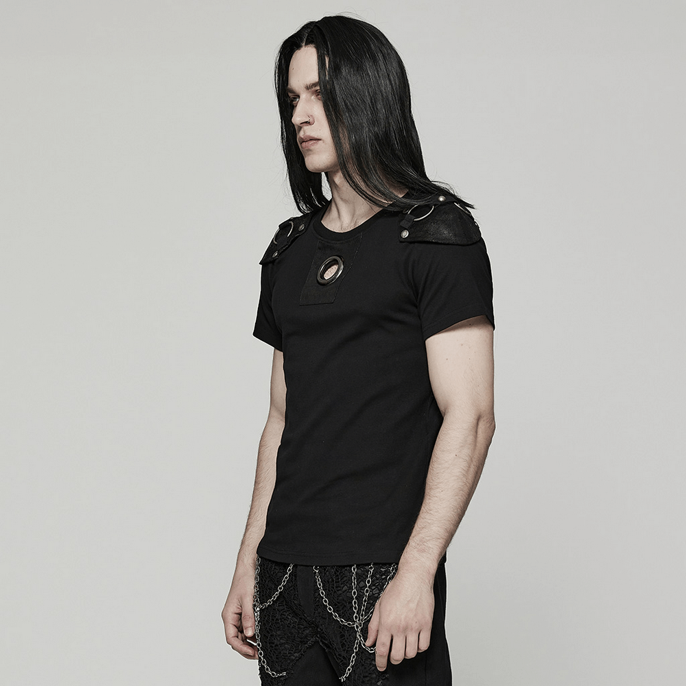Edgy black punk rivet t-shirt with cracked leather detailing and detachable armor panel, styled for a rebellious look.