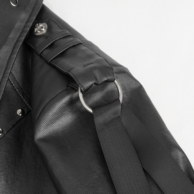 Close-up of black punk jacket featuring webbing straps and rivet detailing for men.