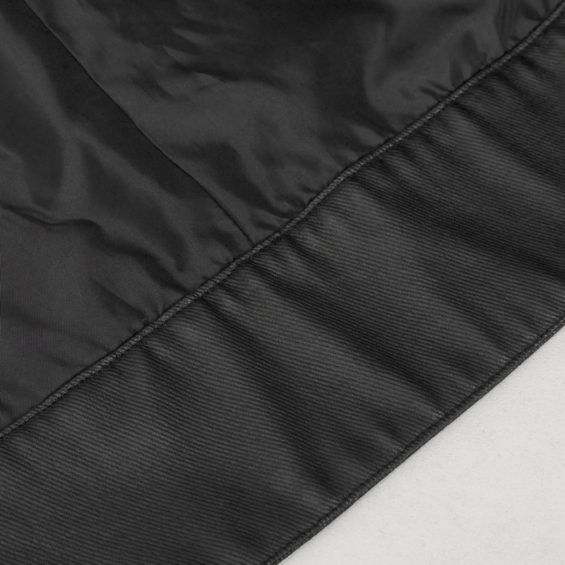 Close-up of the hem detailing on a black punk rivet jacket for men, showcasing its sleek design and quality craftsmanship.