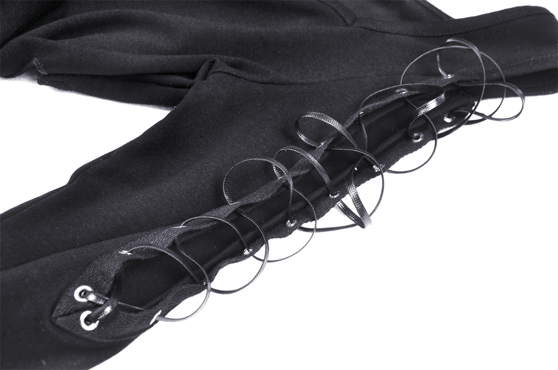 Close-up of lace-up detail on batwing sleeve of punk rock crop top, showcasing edgy black design.