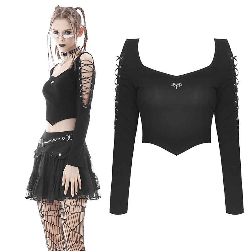 Punk rock batwing long sleeve lace-up crop top in black, styled with a mini skirt and edgy accessories.