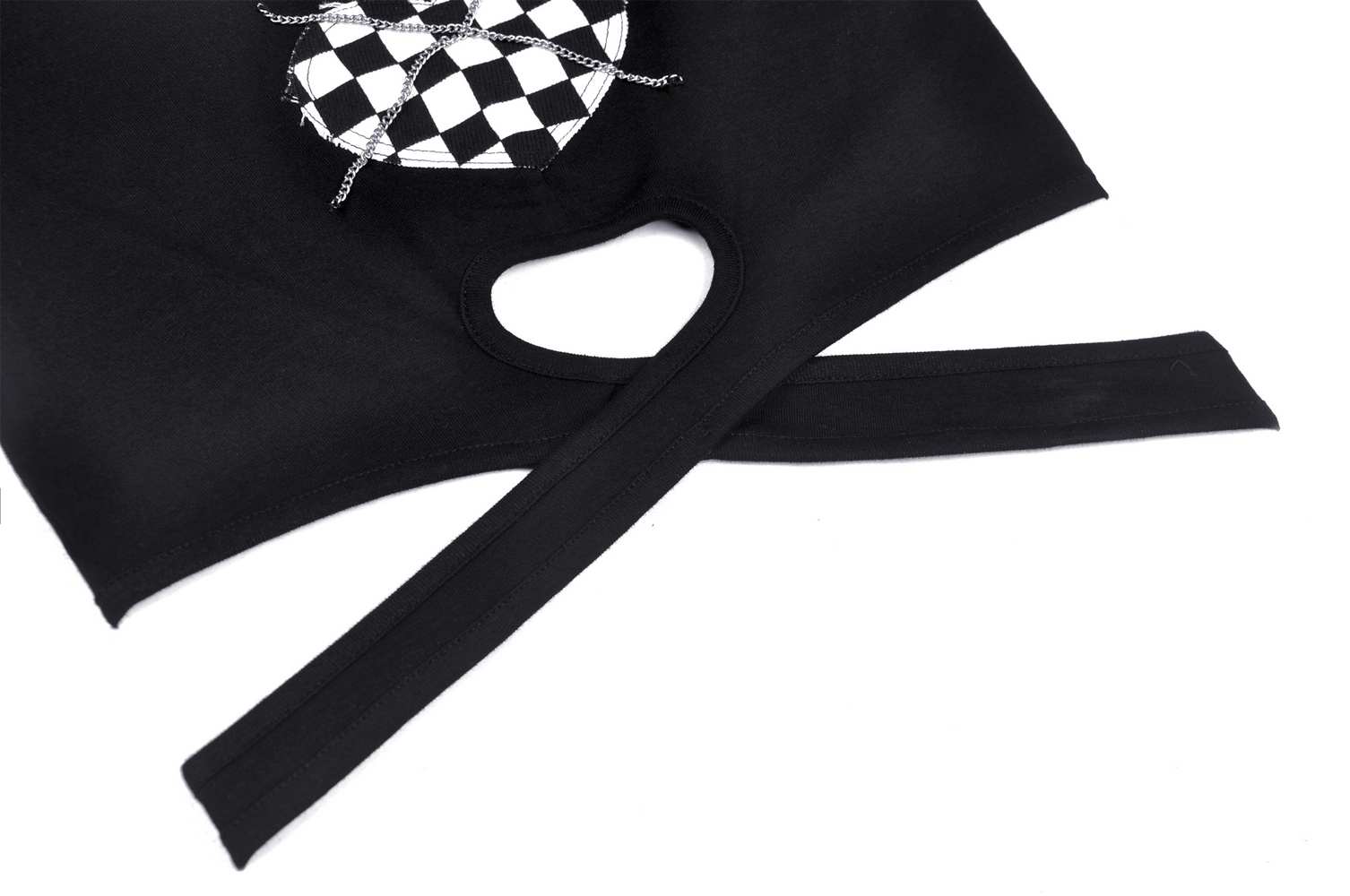 Close-up of edgy black crop top featuring checkered heart design and cross waist with chain detail.