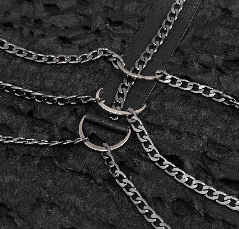 Close-up of punk rock black sleeveless tank top featuring intricate chain detailing and broken hole design.