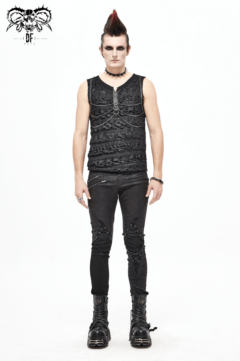 Punk rock style black sleeveless tank top with broken holes, paired with edgy black jeans and chunky boots.