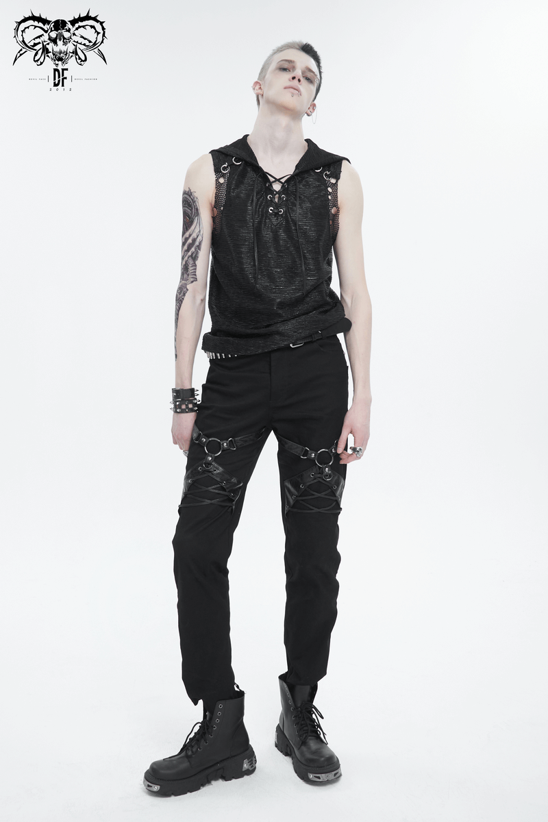 Stylish male model showcasing punk rock fitted pants with leather harness and edgy accessories.