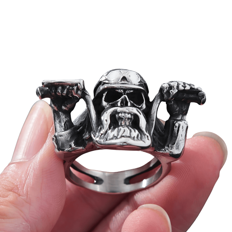 Punk rock skull ring for men held in hand, showcasing bold biker style and stainless steel craftsmanship.