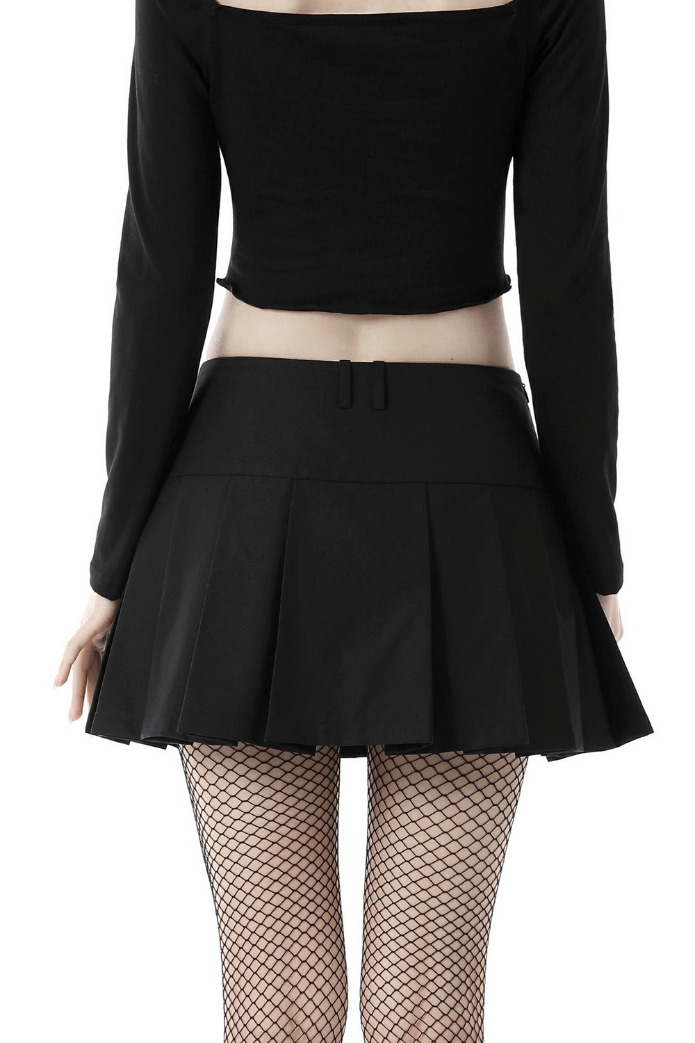Back view of a punk rock pleated mini skirt in black, styled with fishnet tights for a rebellious look.