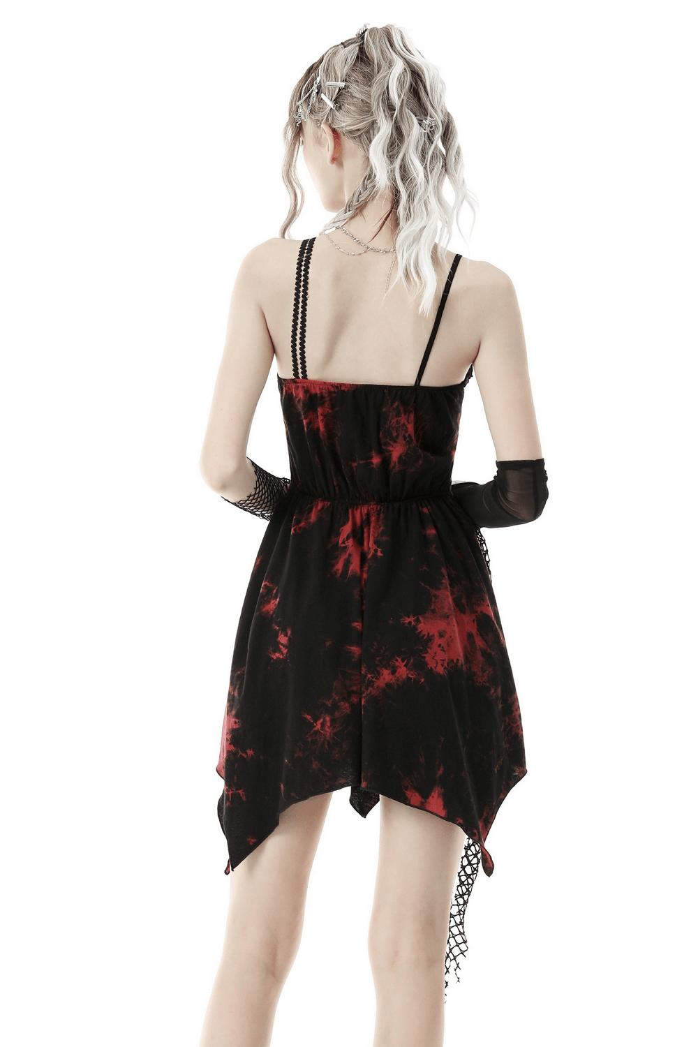 Back view of punk rock red and black asymmetrical dress with mesh overlay and gothic details.
