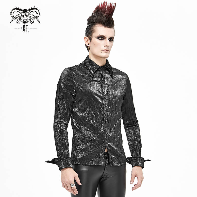 Punk rock style male model wearing a black long-sleeved shirt with creative print and modern cut, showcasing alternative fashion.