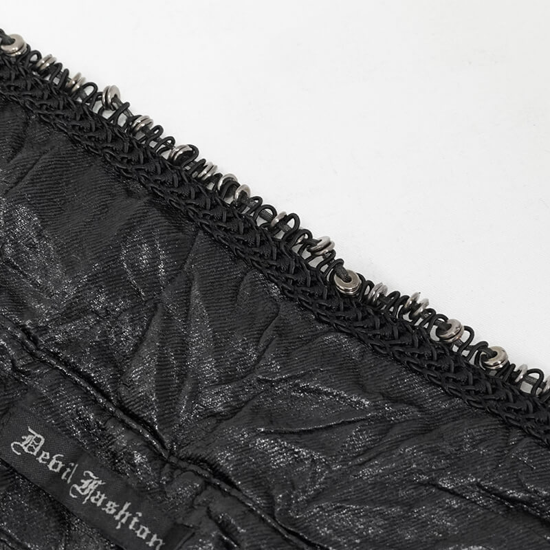 Close-up of punk rock style black shirt detailing with unique stitching and decorative elements.