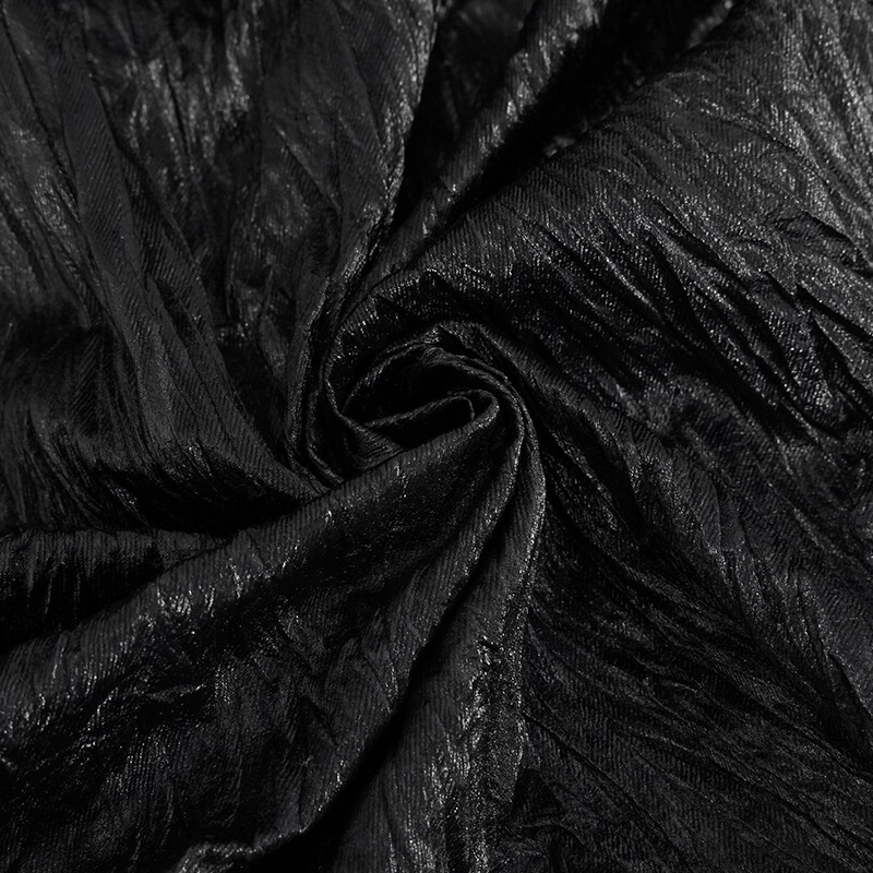 Close-up of textured black fabric perfect for punk rock style men's clothing.