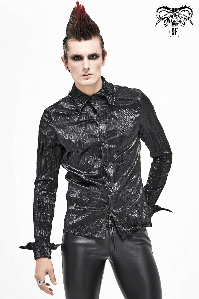 Stylish male model wearing a black punk rock long-sleeved shirt, showcasing alternative fashion aesthetics.