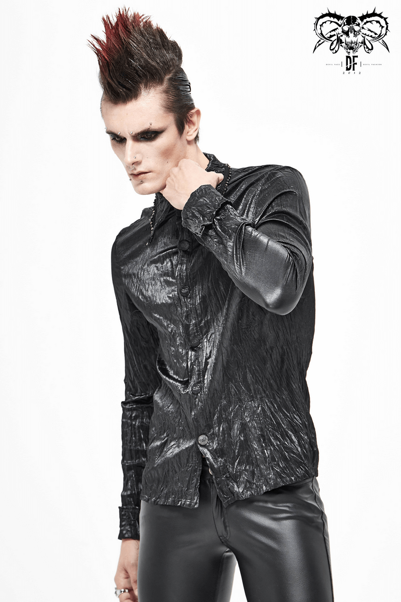 Stylish male model in a punk rock black long-sleeved shirt, showcasing an edgy alternative fashion look.