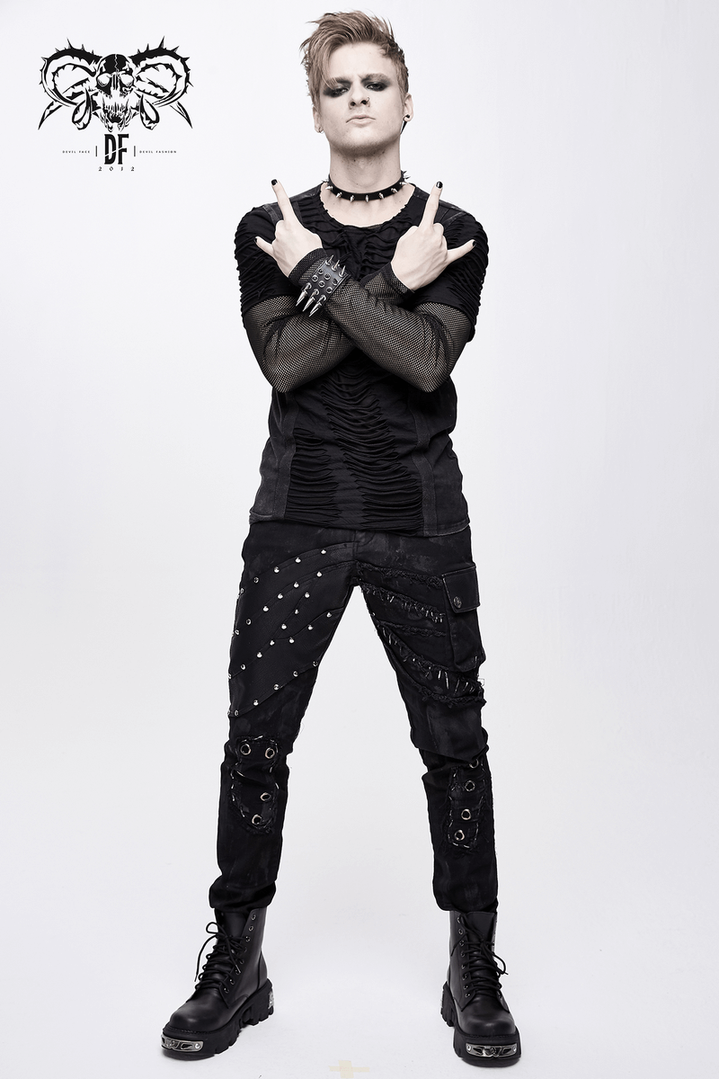 Men's punk rock trousers with studs, black biker pants, stylish free cut outfit.