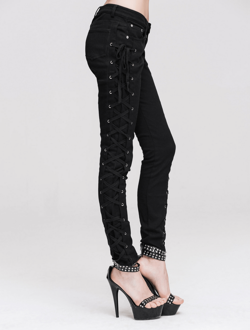 Stylish punk rock women's black skinny pants with lace-up detail on both sides, paired with chic high heels.