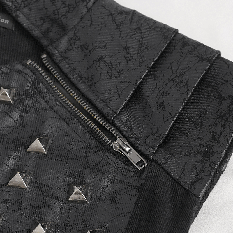 Close-up of punk rock zip-up waistcoat with studded front and textured fabric detail.