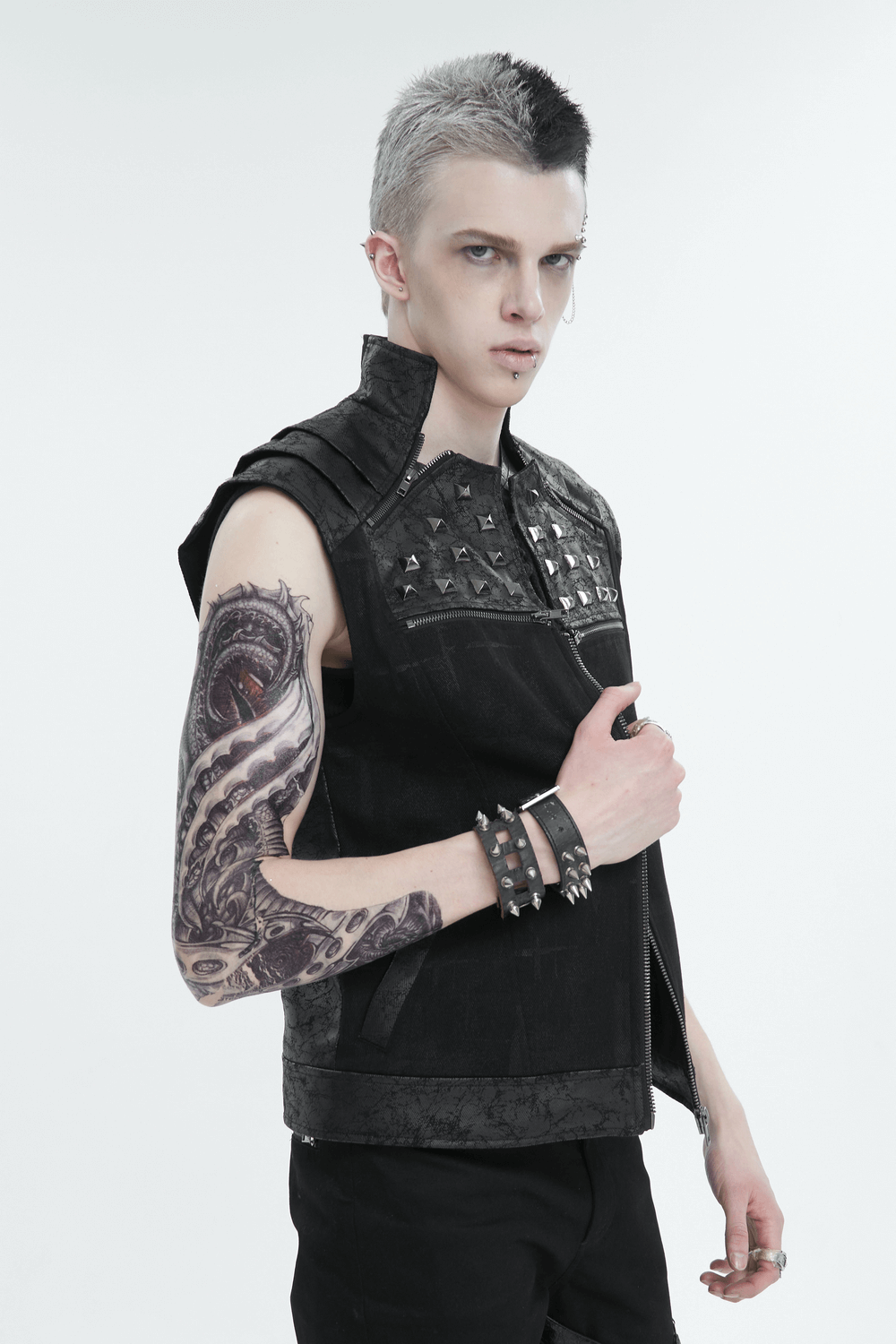 Men's punk rock zip-up waistcoat with lace-up back and studded collar, showcasing edgy fashion and tattoos.