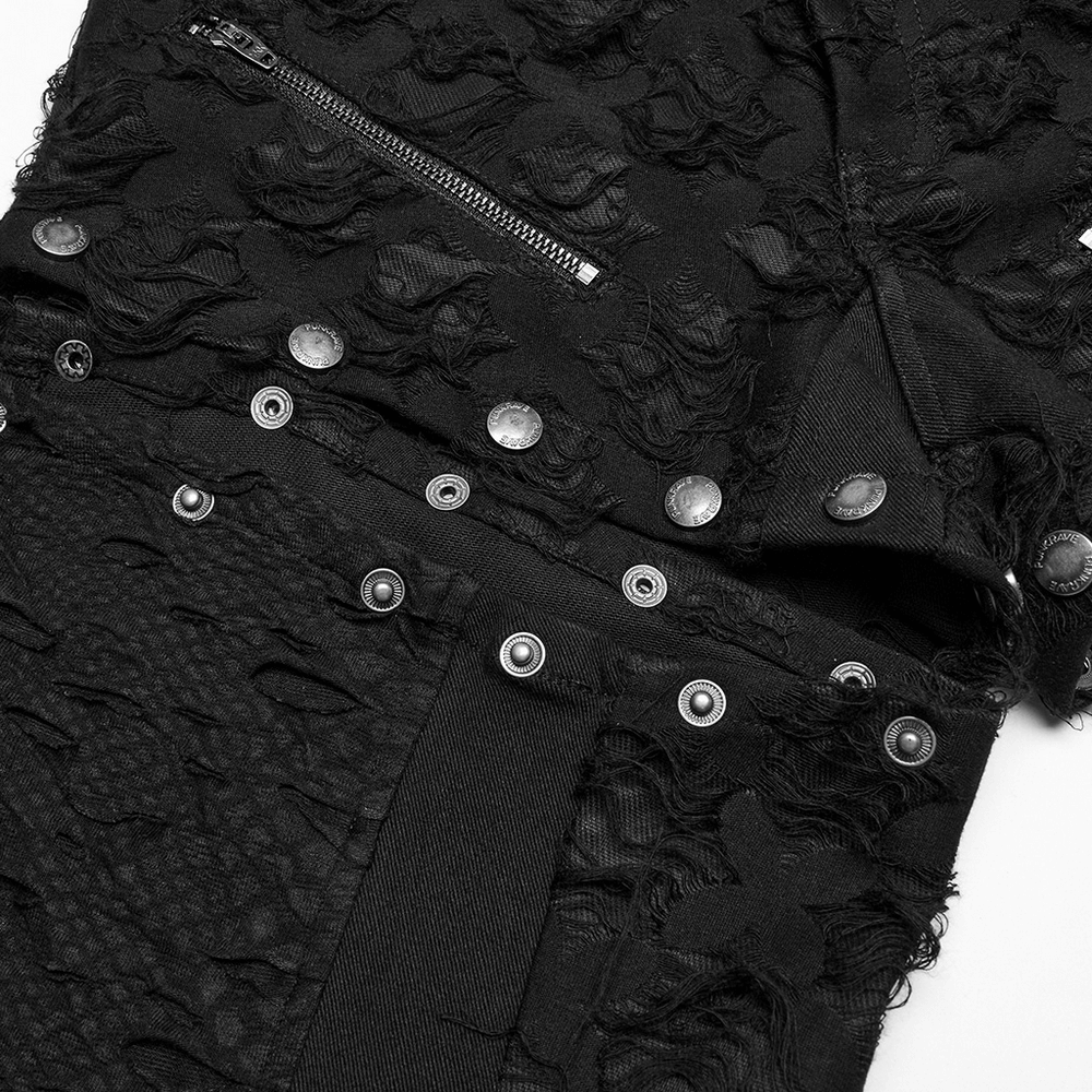 Close-up of punk-style black split wide leg pants with tattered fabric and snap button detailing.