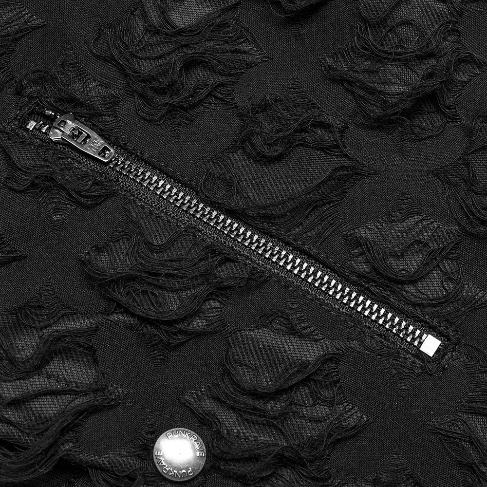 Close-up of tattered black fabric featuring a zipper, showcasing punk-inspired texture and design.