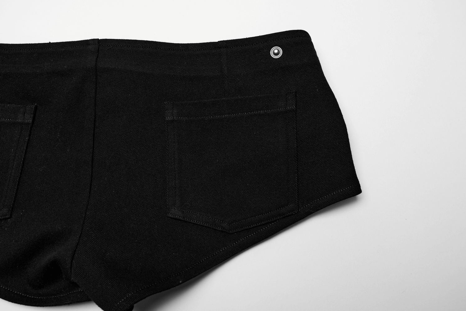 Edgy black shorts with stylish back pockets, perfect for a punk rock outfit.