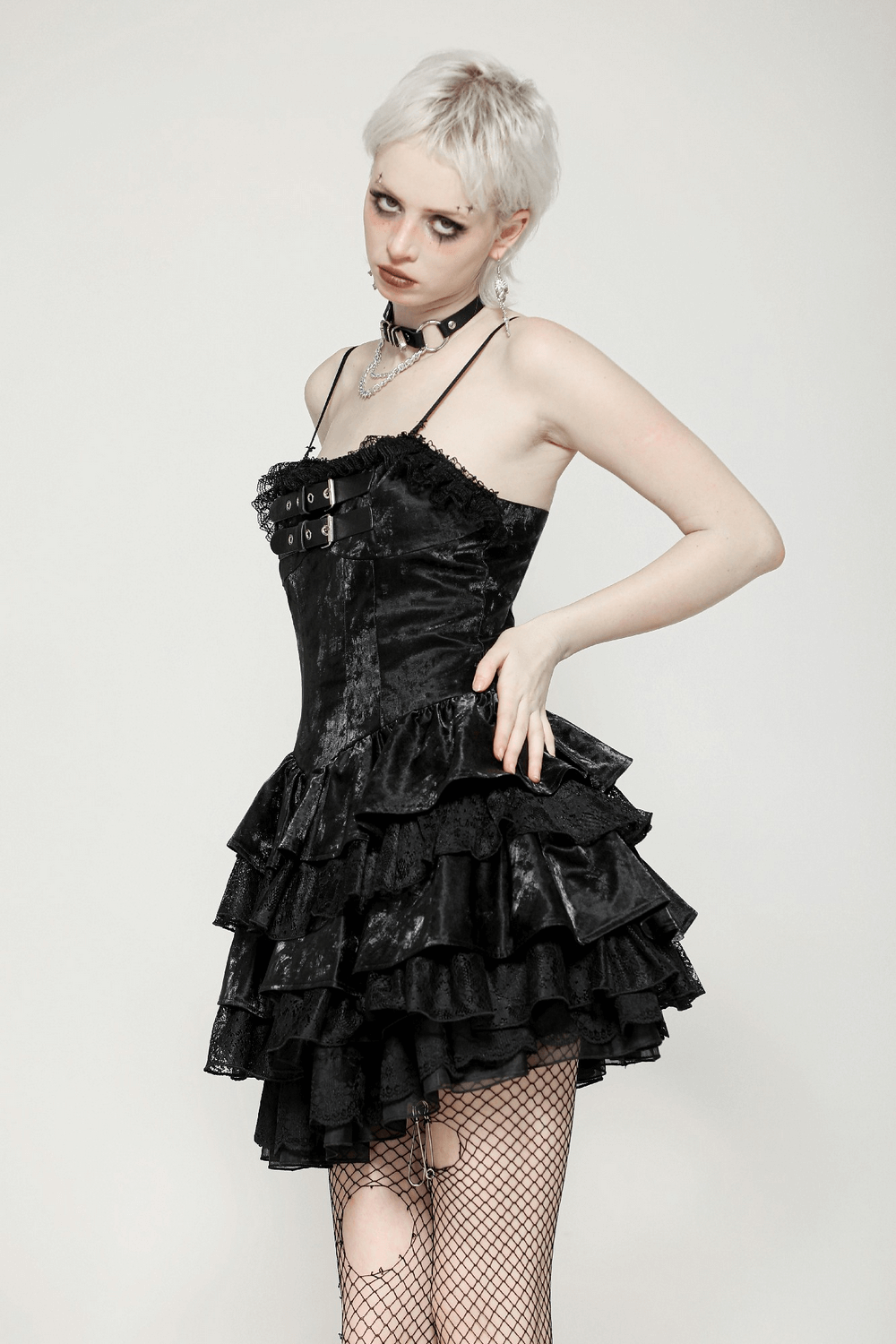 Gothic black PU leather layered mini dress with ruffled lace, punk style, perfect for alternative fashion lovers.