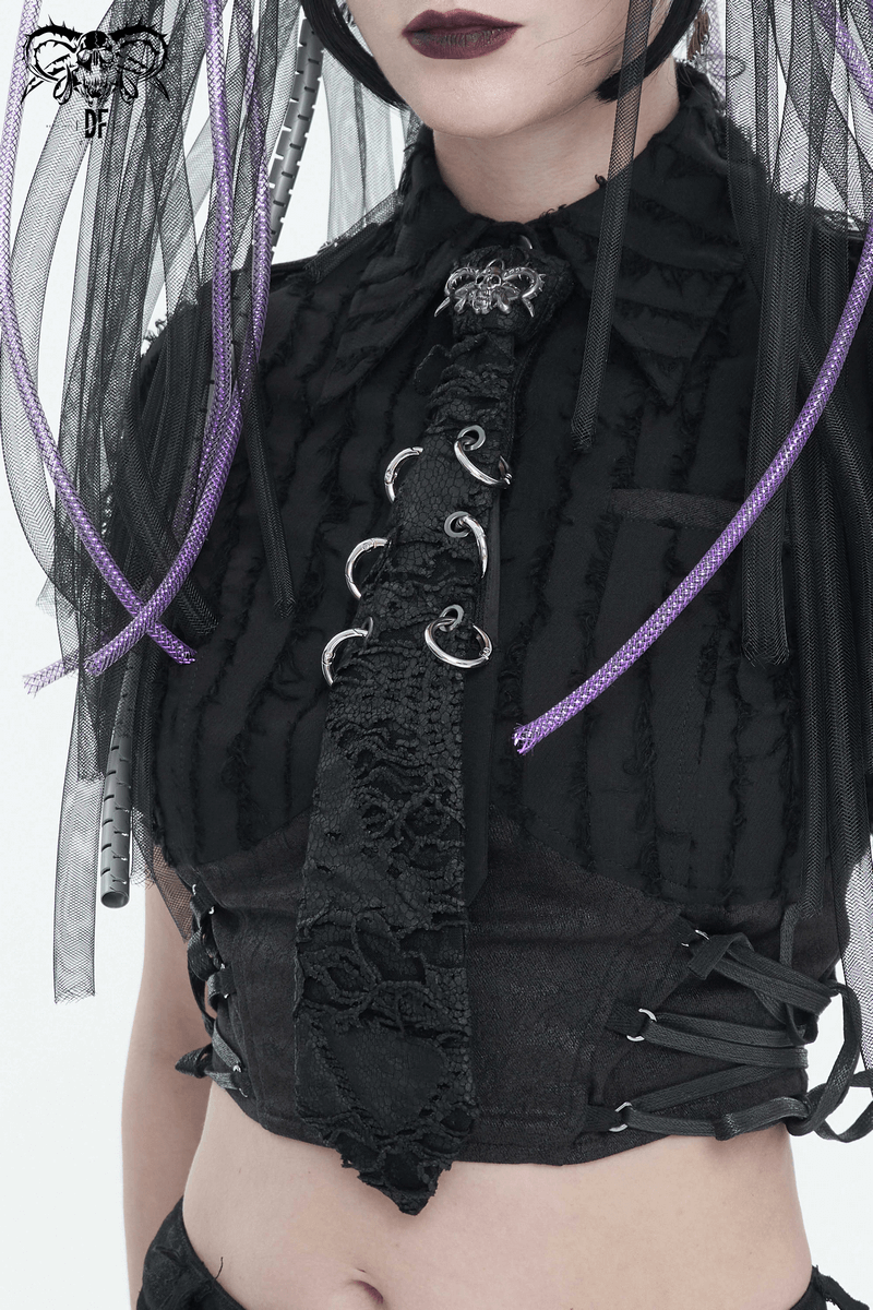 Gothic women's punk skull necktie with metal rings, paired with an edgy black outfit.