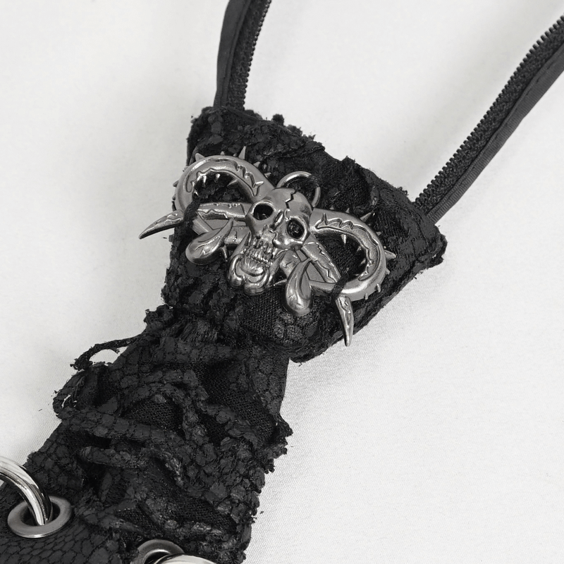Close-up of a punk skull necktie featuring a metallic skull and spiked detail, perfect for gothic style.