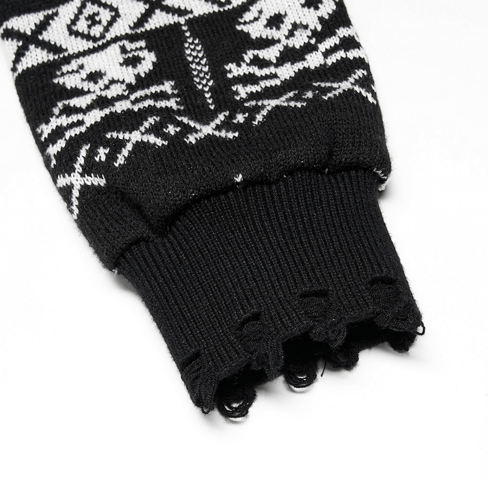 Detail of black pullover sleeve featuring unique punk skull pattern and ribbed cuff design.