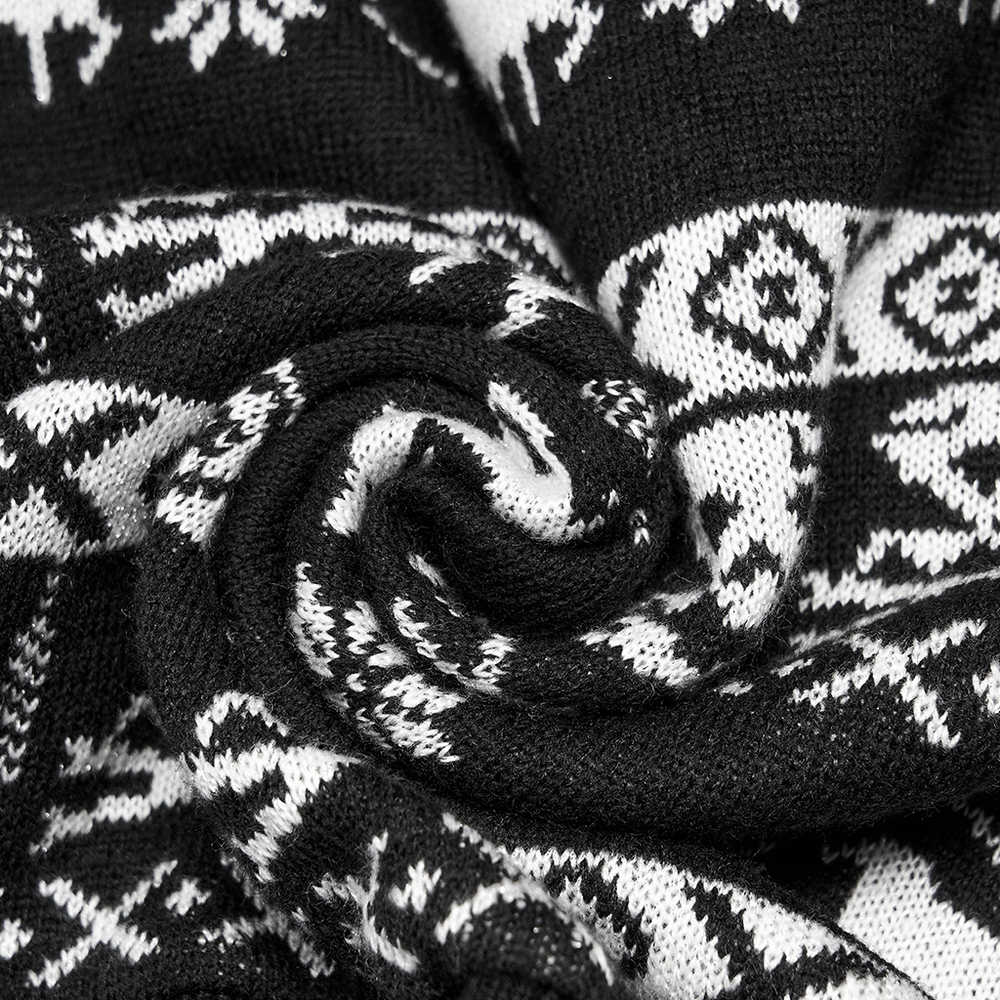 Close-up of textured black and white skull pattern fabric, perfect for a punk style pullover with removable sleeves.