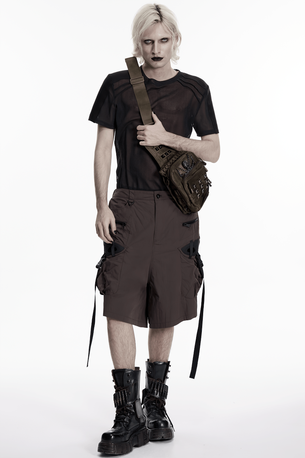 Punk Skull Stud Crossbody Backpack with Strap worn by a model in edgy streetwear outfit, showcasing tactical pockets and rugged style.