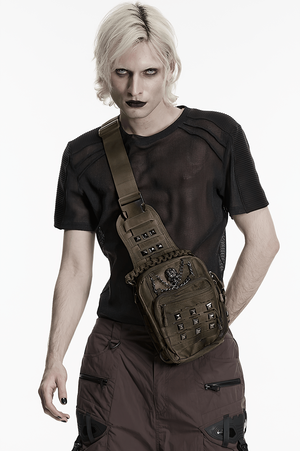 Punk Skull Stud Crossbody Backpack with Strap worn by model, featuring tactical pockets and pyramid studs.