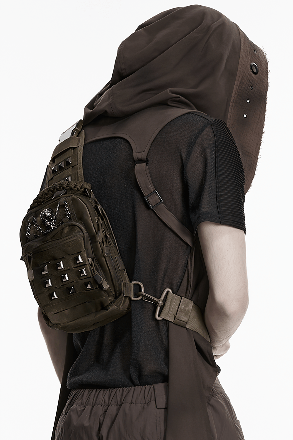 Punk Skull Stud Crossbody Backpack with Strap worn on person, showcasing tactical pockets and metallic studs.