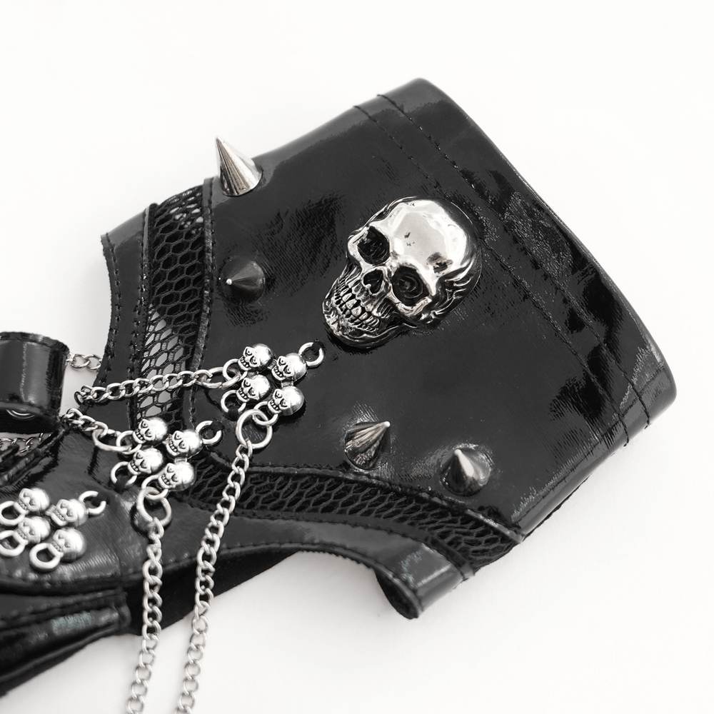 Close-up of punk skull studded half-finger glove with chains and spikes, perfect for gothic fashion enthusiasts.