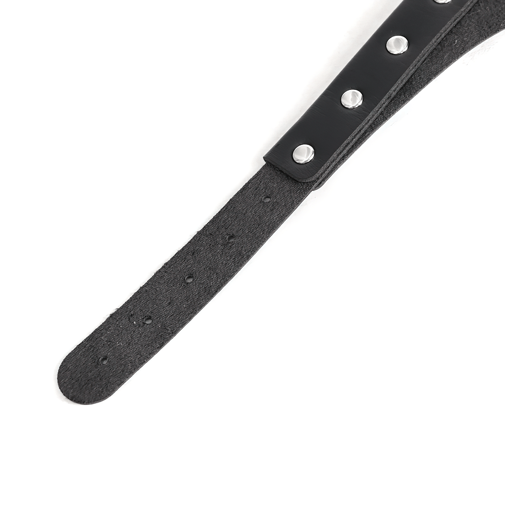Close-up of a black spiked belt choker strap with decorative rivets, showcasing edgy punk style.