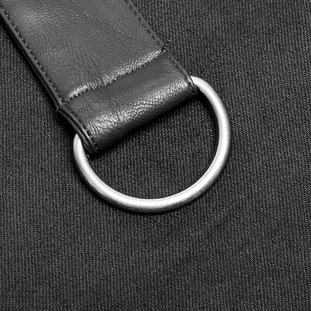 Close-up of adjustable buckle and metal ring on punk leather half kilt skirt for added style and function.