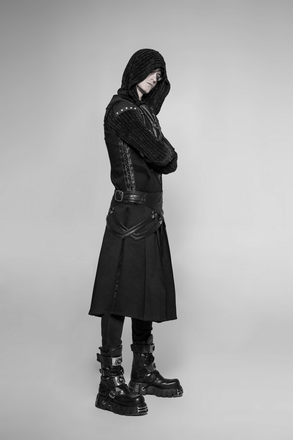 Model showcasing Punk Spliced PU Leather Detachable Half Kilt Skirt with edgy style and bold accessories.