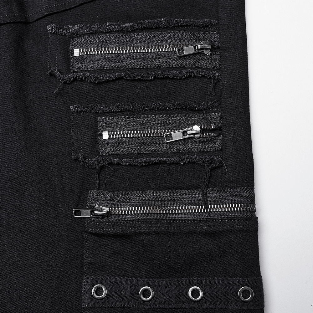 Close-up of black denim pants with edgy zipper accents and rough edges for a punk look.