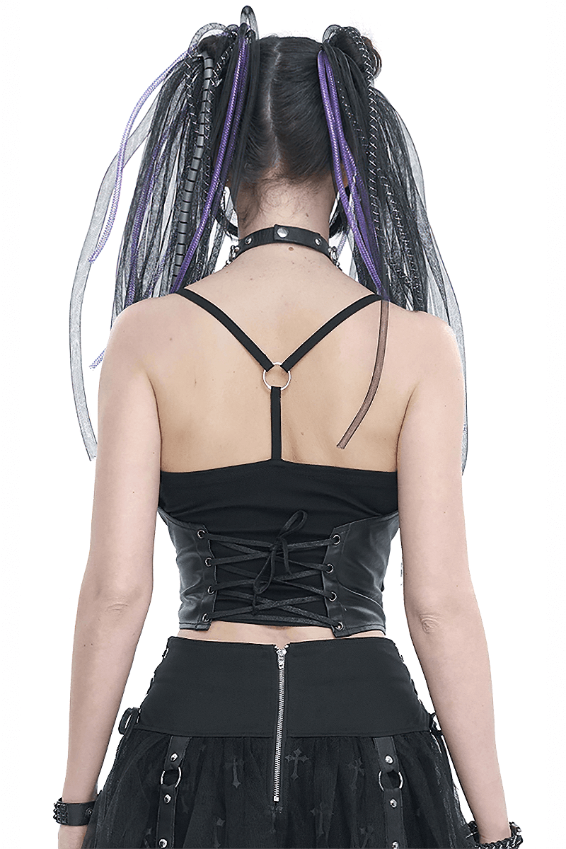 Back view of a black gothic spaghetti strap tank with lace-up detail, styled with edgy pigtails and accessories.