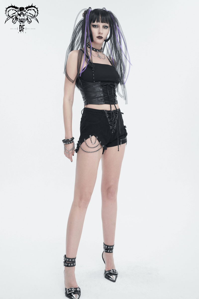 Stylish woman in black gothic strappy camis and shorts, showcasing punk fashion with lace-up and edgy accessories.