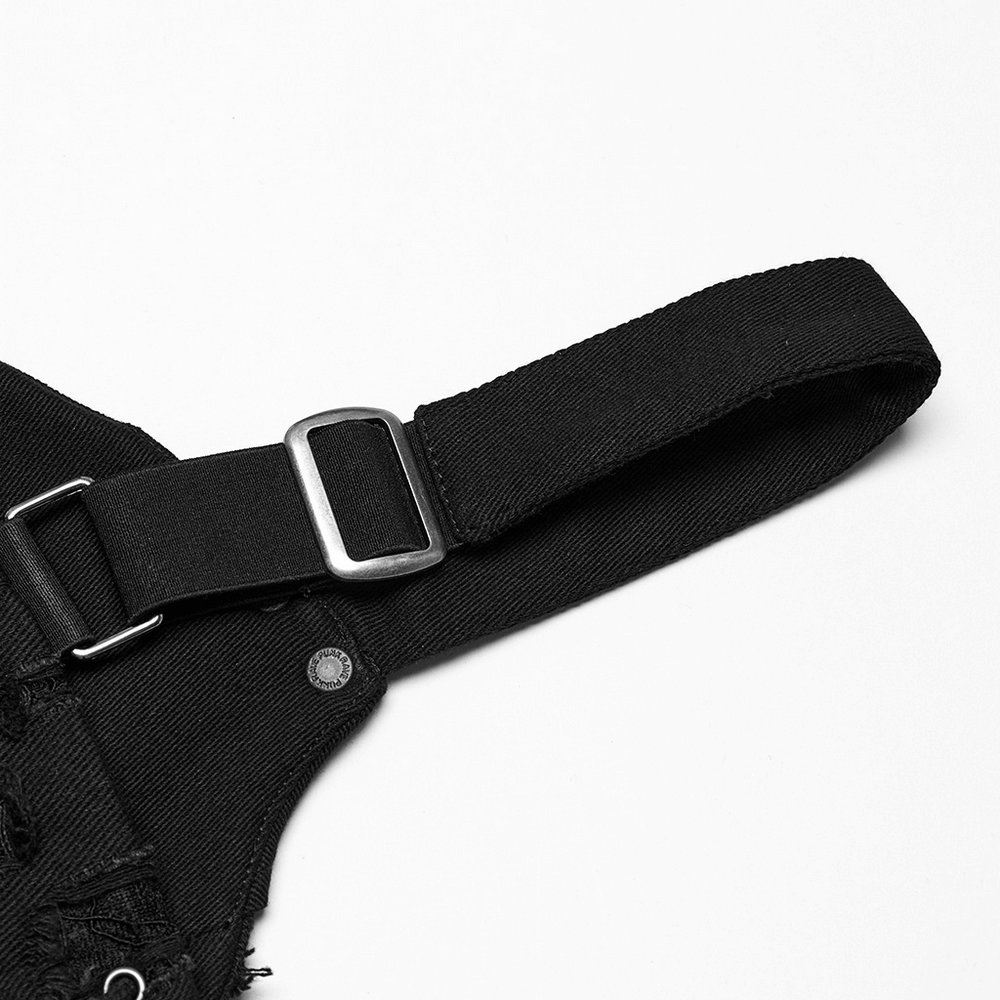 Close-up of adjustable strap detail on a punk studded denim top, showcasing the unique design and style.