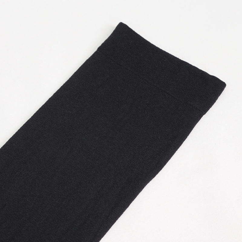 Close-up of black punk style asymmetrical sock, featuring a sleek design and detailed texture for alternative fashion lovers.
