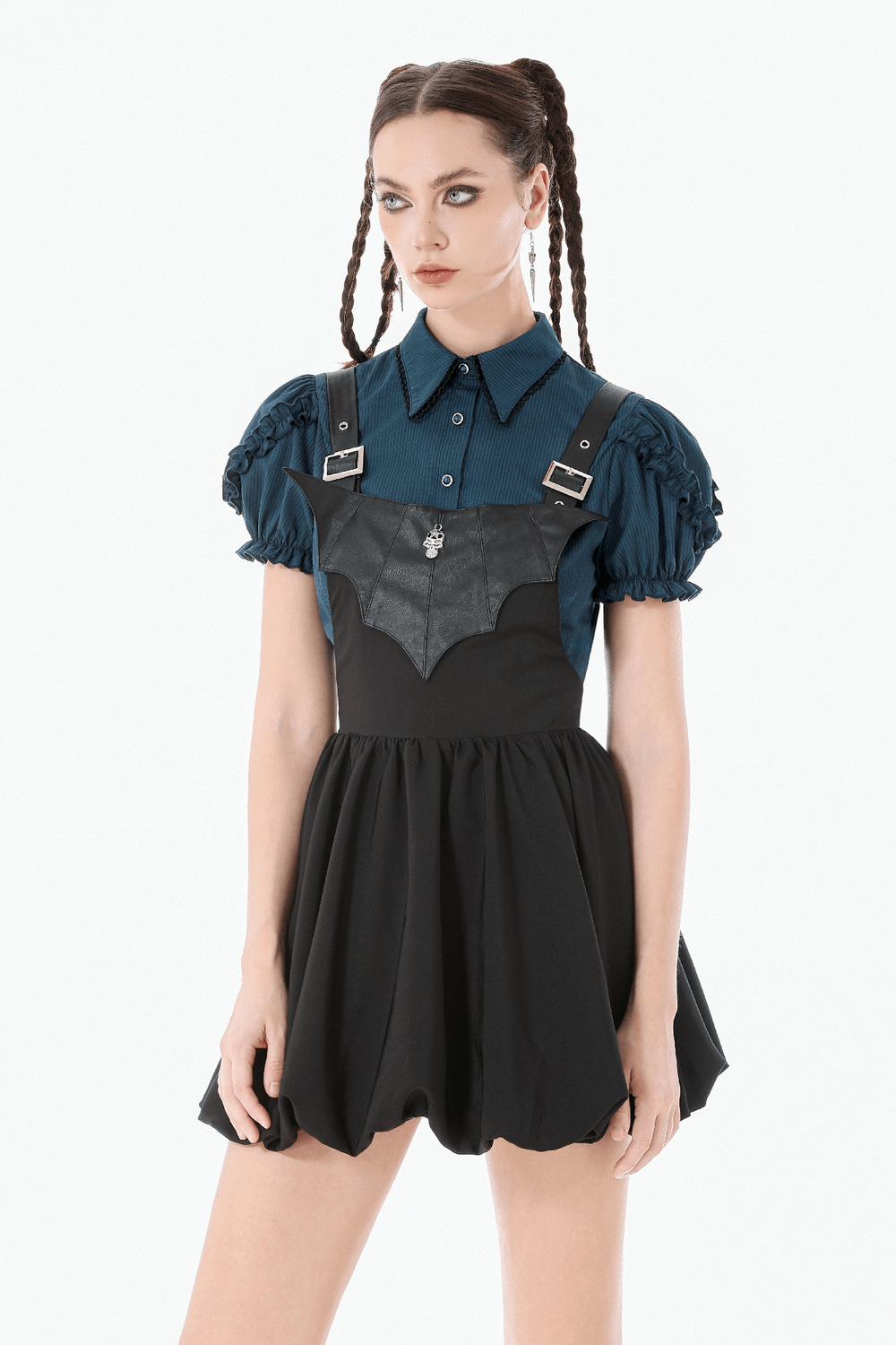 Punk Style Black Dress with Bat Bodice and Heart Detail worn by a model with a blue blouse and braided hair.